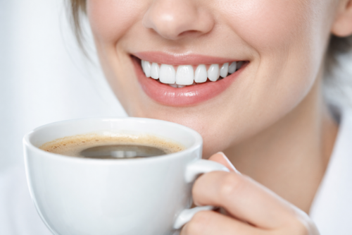 Person brushing bonded teeth carefully