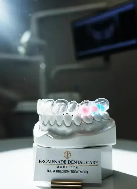 Custom hard-acrylic nightguard for TMJ and bruxism treatment at Promenade Dental Care in Murrieta