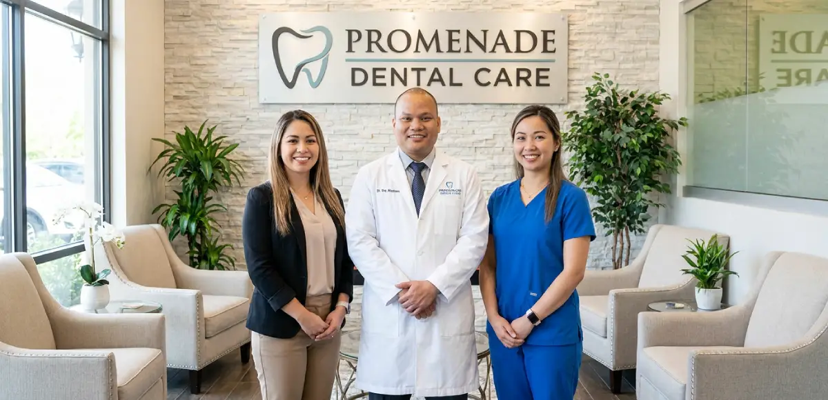 Dr bao standing with two others in loby