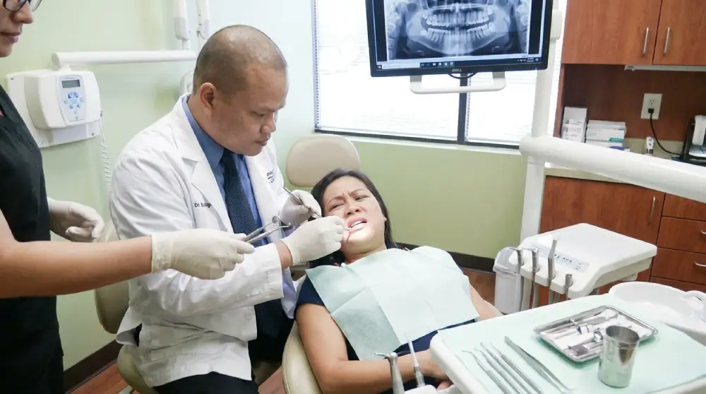 Dr. Bao Nguyen, DDS treating a same-day emergency dental patient in Murrieta.